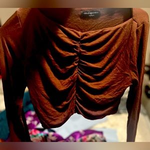 Brown long sleeve crop top. Stretchy material.